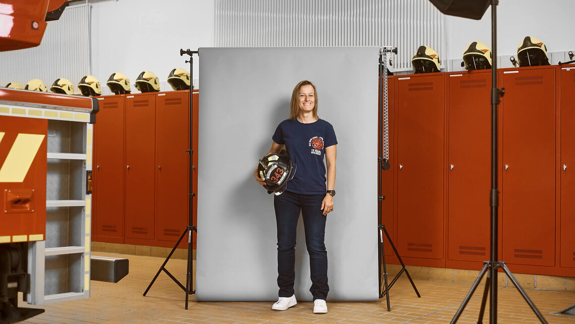Monique with a firefighter's helmet from the New York Fire Department.