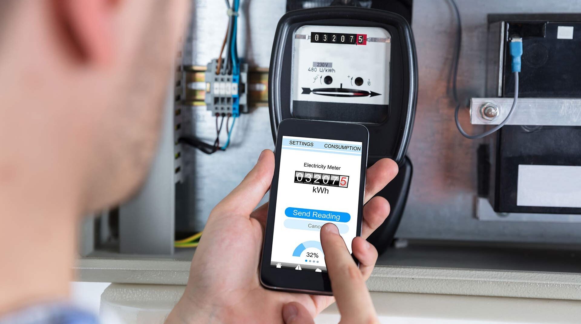 Man looks at power meter Man looks at power meter