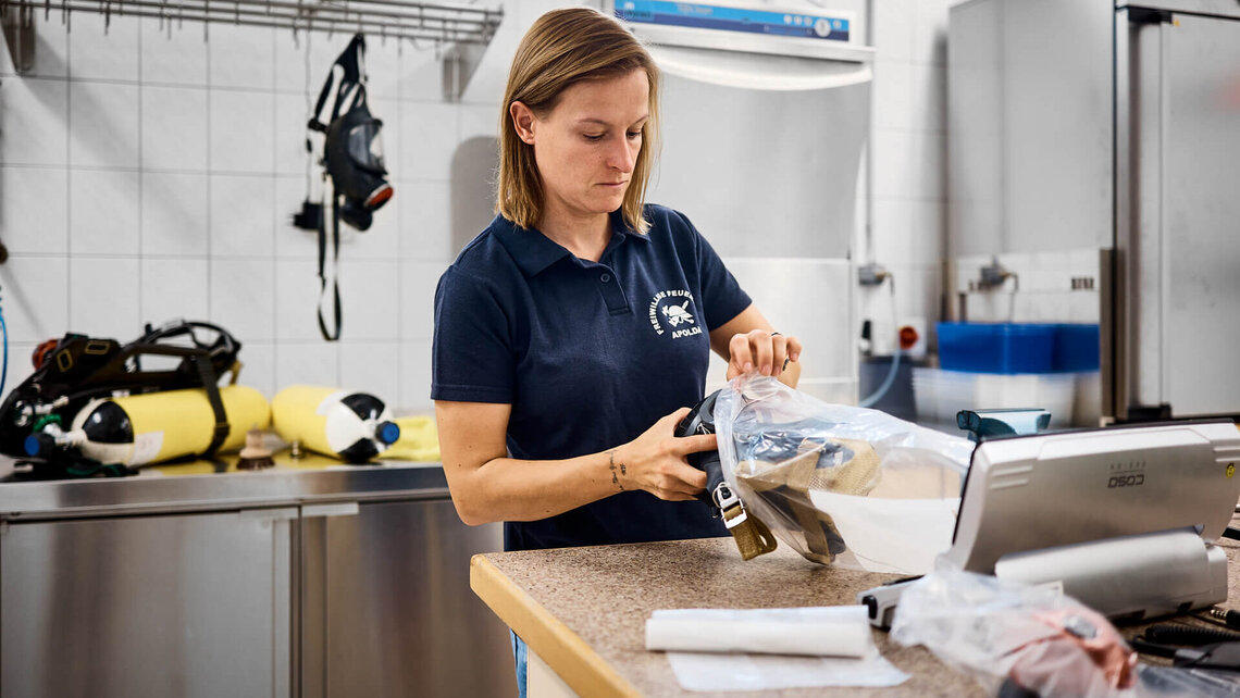 Monique unpacking a BA mask.