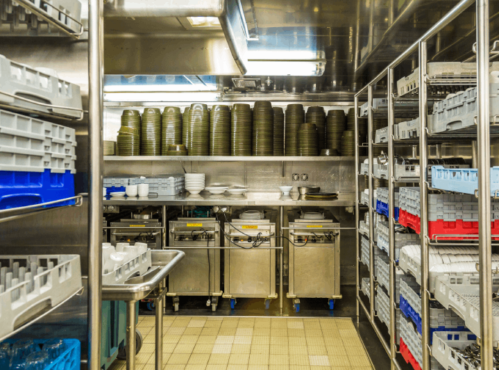Section of the commercial kitchen with crockery and cutlery A section of the commercial kitchen where dishwashing and inventory are managed by stewarding staff.
