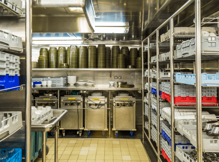 Section of the commercial kitchen with crockery and cutlery A section of the commercial kitchen where dishwashing and inventory are managed by stewarding staff.