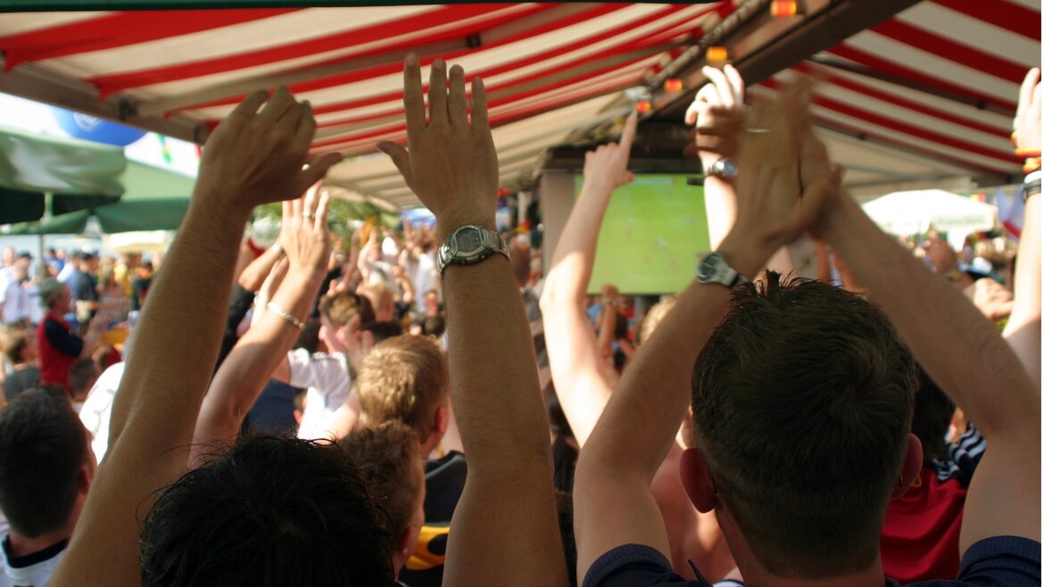 Cheering football fans Cheering football fans