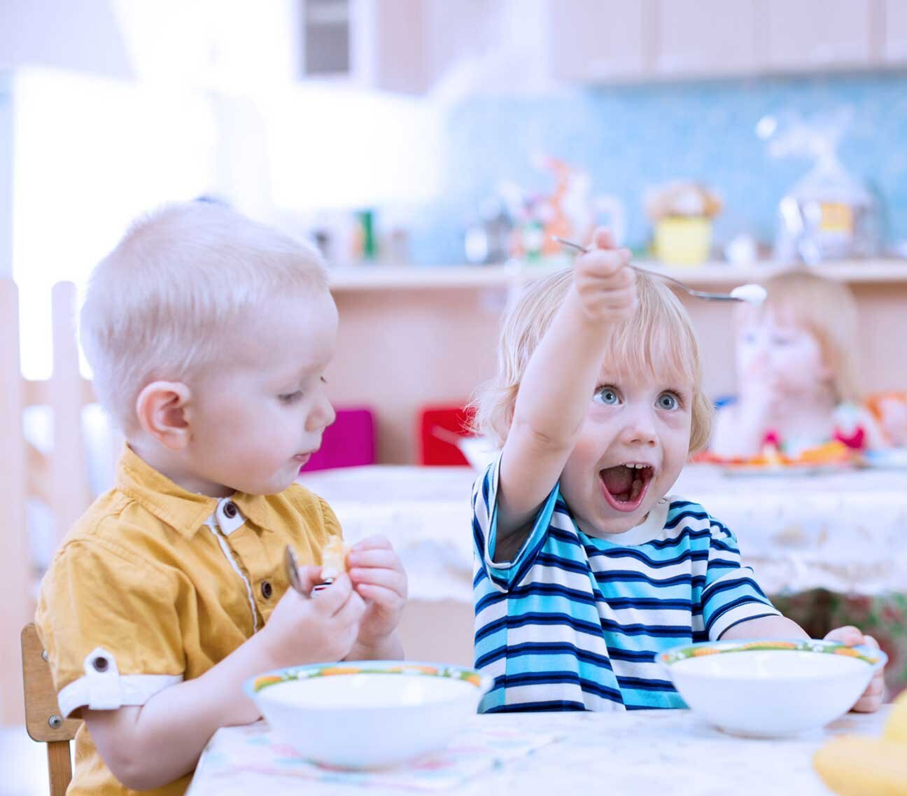 A small child happily eating A small child happily eating